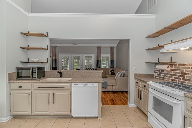 kitchen with sink, tasteful backsplash, white appliances, light tile patterned floors, and ornamental molding