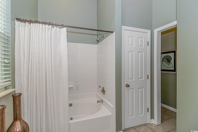 bathroom featuring shower / bath combo and tile patterned floors