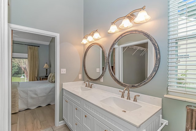 bathroom with vanity and hardwood / wood-style flooring