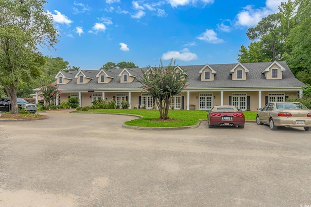 cape cod-style house with french doors