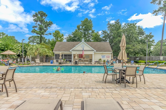 view of pool featuring a patio and an outdoor structure