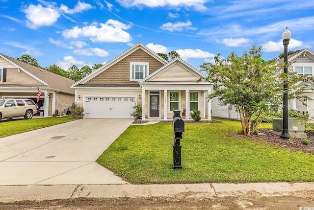 view of front of property with a front yard and a garage