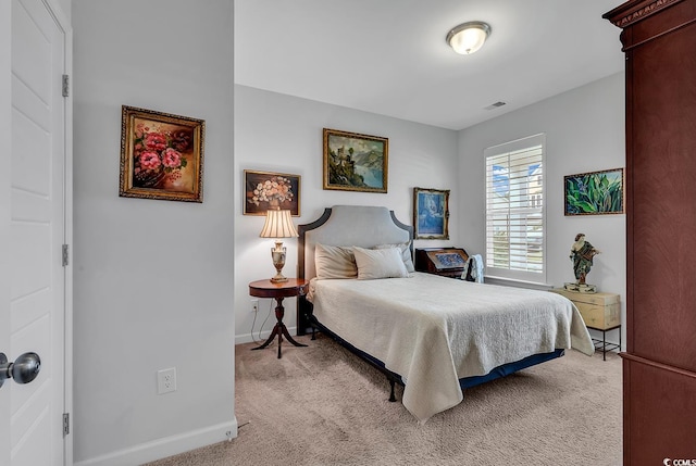 bedroom featuring light colored carpet