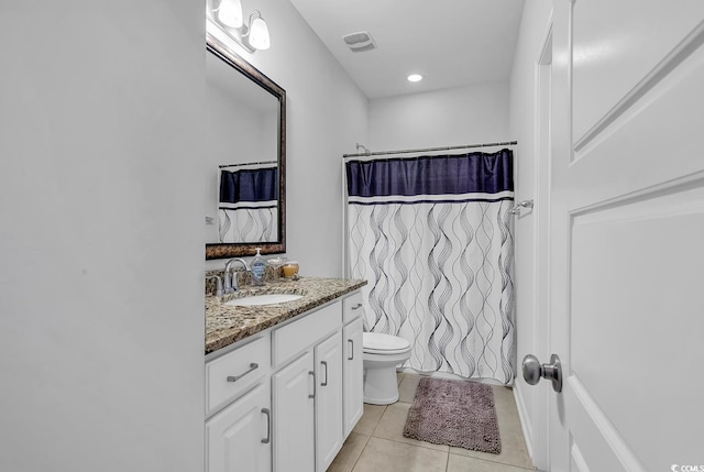 bathroom featuring a shower with shower curtain, tile patterned flooring, vanity, and toilet