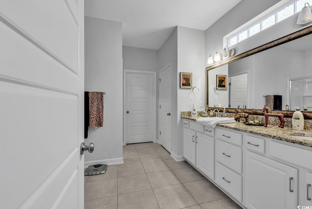 bathroom with vanity and tile patterned flooring