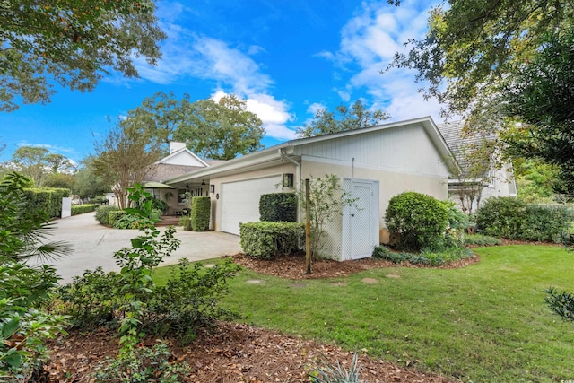 view of property exterior featuring a yard and a garage