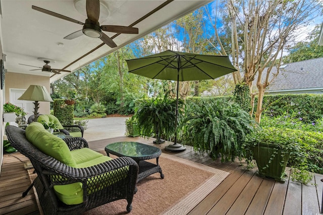 wooden terrace featuring ceiling fan