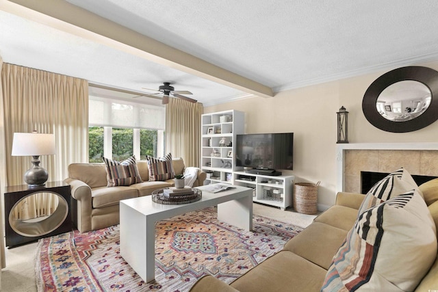 carpeted living room with a fireplace, beam ceiling, a textured ceiling, and crown molding