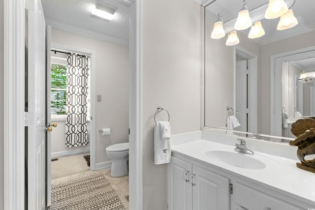 bathroom with tile patterned flooring, a textured ceiling, toilet, vanity, and ornamental molding