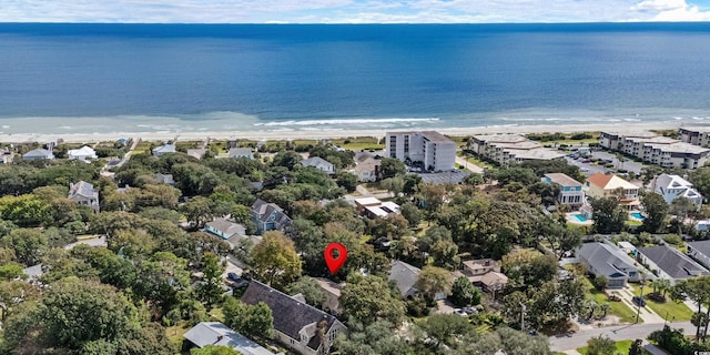 birds eye view of property with a beach view and a water view