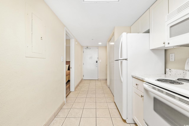 kitchen featuring white cabinets, white appliances, electric panel, and light tile patterned flooring