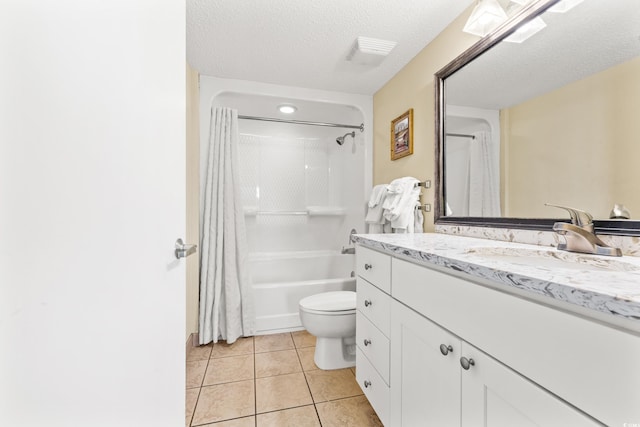 full bathroom featuring vanity, toilet, shower / bath combo, a textured ceiling, and tile patterned flooring