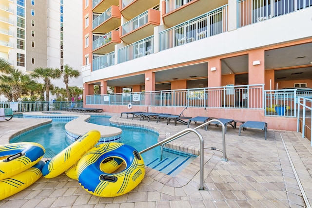 view of pool featuring a patio area