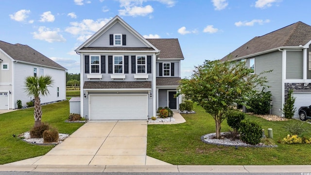 view of front property featuring a garage and a front lawn