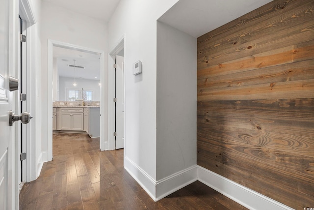 corridor with dark wood-type flooring