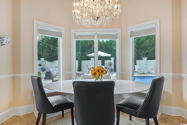 dining room with a wealth of natural light and a notable chandelier