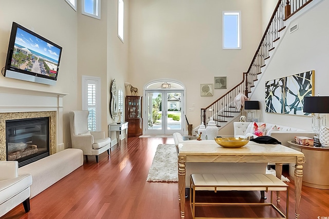 interior space featuring a high ceiling and wood-type flooring