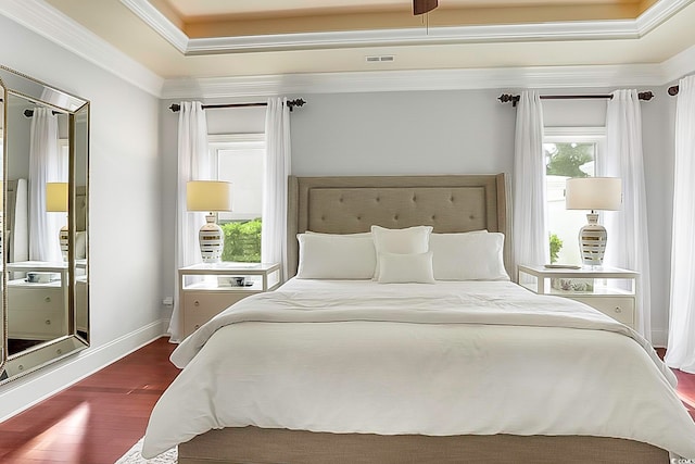 bedroom with dark hardwood / wood-style flooring and crown molding