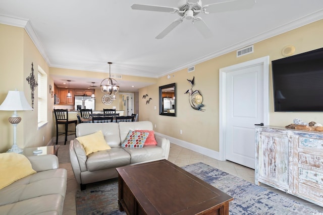 tiled living room featuring ceiling fan with notable chandelier and crown molding