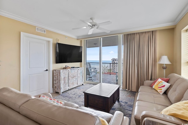 living room featuring crown molding and ceiling fan