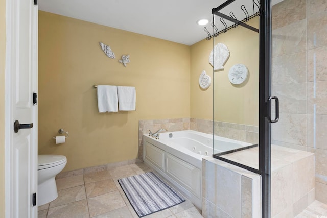 bathroom featuring shower with separate bathtub, tile patterned flooring, and toilet