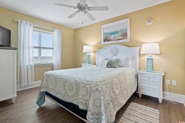 bedroom featuring ceiling fan and dark hardwood / wood-style flooring