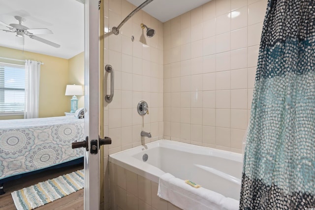 bathroom featuring ceiling fan, hardwood / wood-style flooring, and shower / bath combo