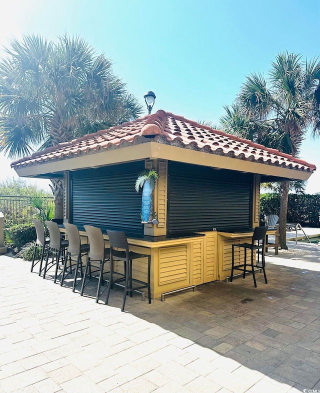 view of patio / terrace featuring exterior bar