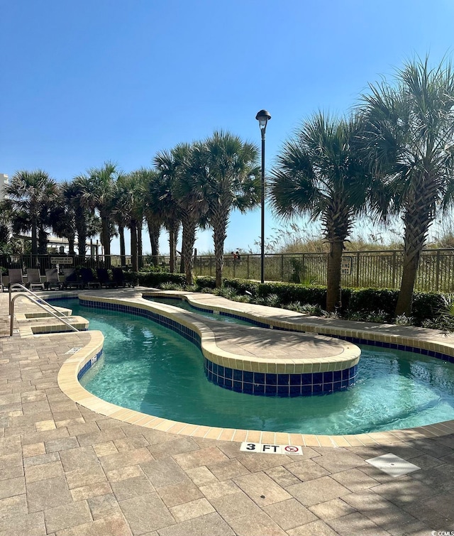 view of pool featuring a patio area