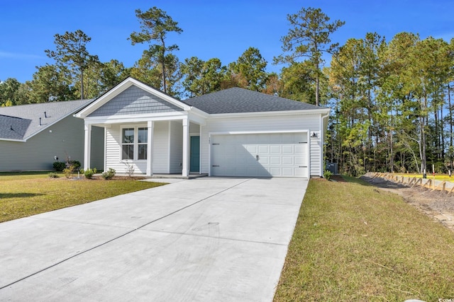 view of front facade with a front yard, concrete driveway, and a garage