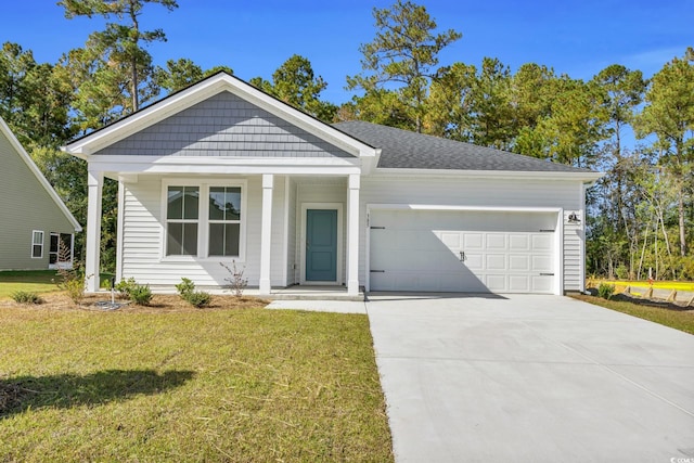 view of front of property with a front lawn and a garage