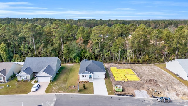 drone / aerial view featuring a view of trees
