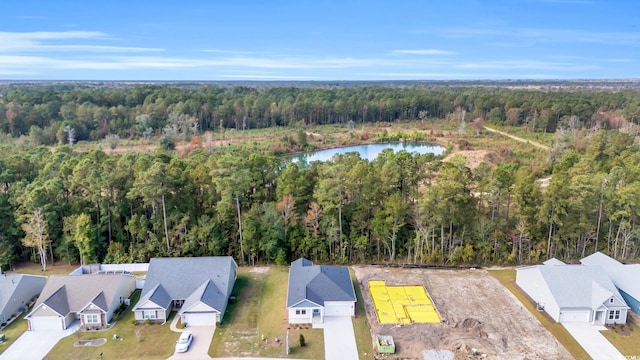 bird's eye view featuring a residential view, a water view, and a wooded view