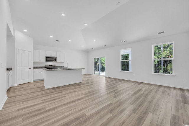 kitchen with white cabinets, visible vents, recessed lighting, appliances with stainless steel finishes, and open floor plan