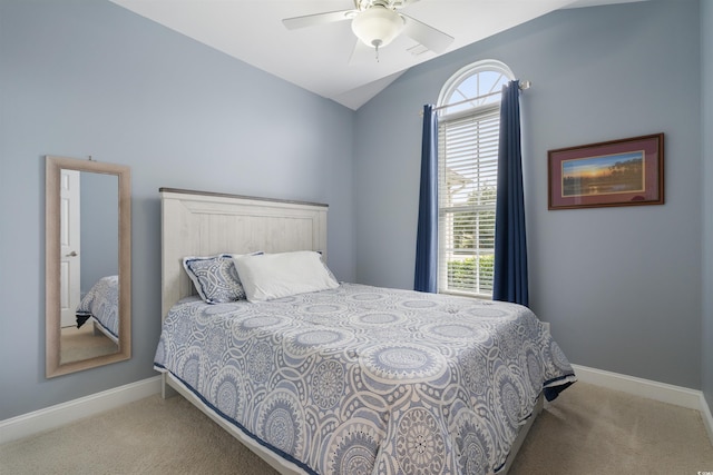 carpeted bedroom with lofted ceiling and ceiling fan