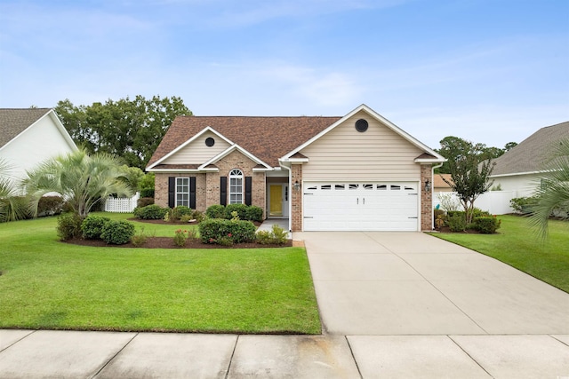 single story home featuring a garage and a front yard