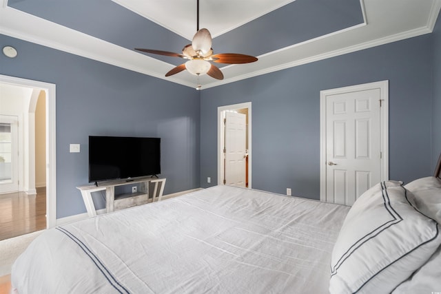 bedroom featuring ornamental molding and ceiling fan