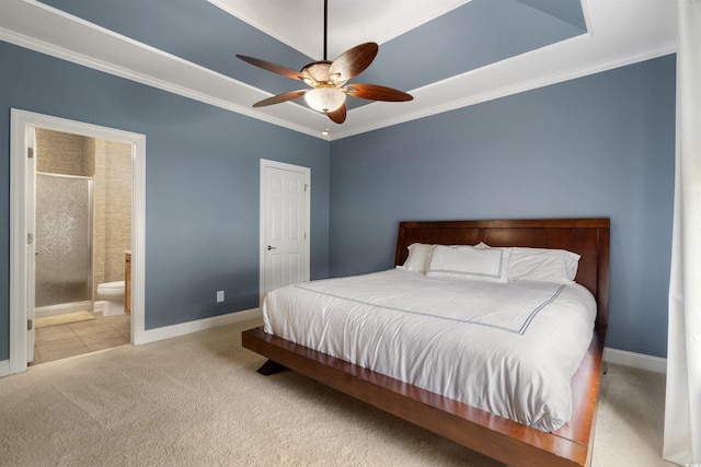 carpeted bedroom with ceiling fan, ensuite bathroom, and ornamental molding