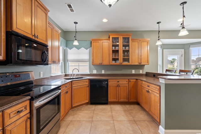 kitchen featuring sink, light tile patterned floors, pendant lighting, kitchen peninsula, and black appliances