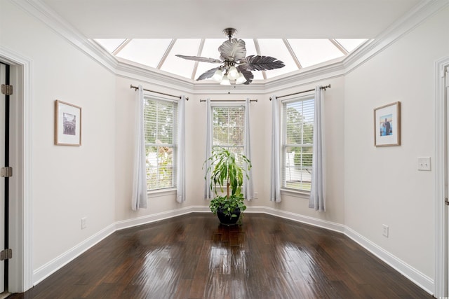 unfurnished room with wood-type flooring, ceiling fan, crown molding, and a wealth of natural light