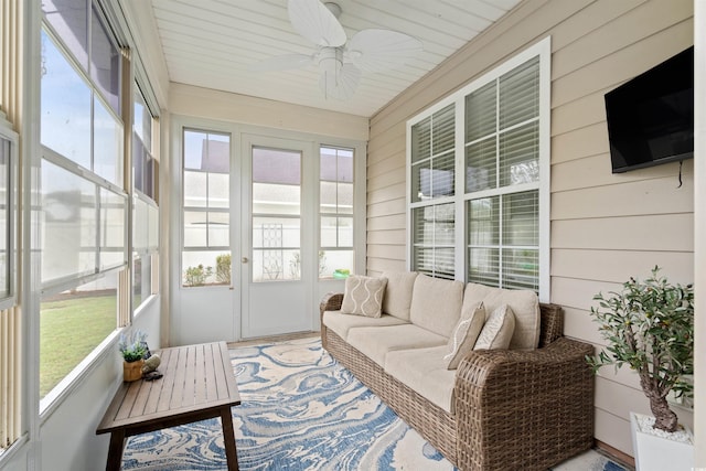 sunroom / solarium featuring ceiling fan and plenty of natural light