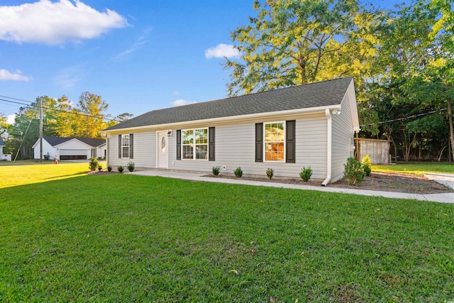 ranch-style house featuring a front lawn