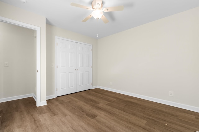 unfurnished bedroom featuring a closet, ceiling fan, and hardwood / wood-style flooring