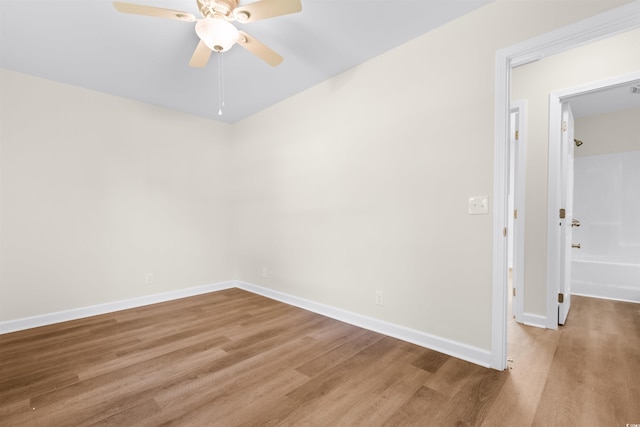 spare room with light hardwood / wood-style flooring and ceiling fan