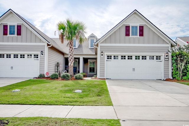 craftsman-style house featuring a garage and a front lawn