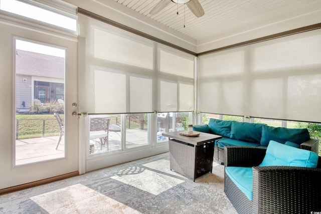 sunroom featuring ceiling fan