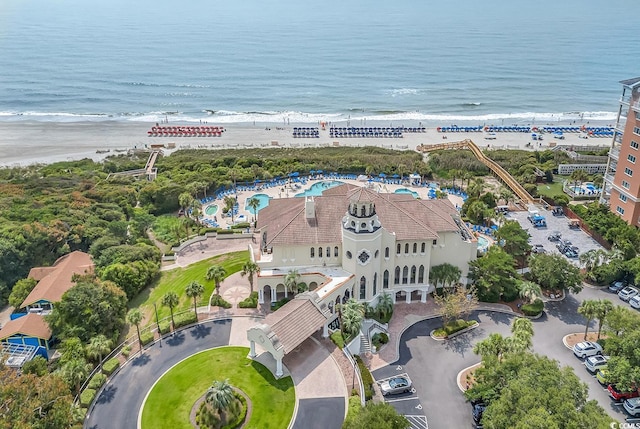 aerial view with a water view and a view of the beach