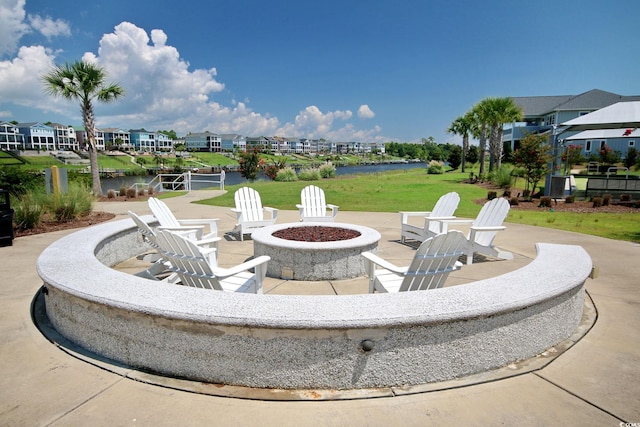 view of patio / terrace with a water view and an outdoor fire pit