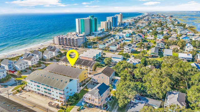 birds eye view of property featuring a water view and a view of the beach