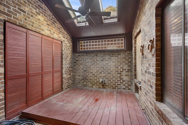 wooden terrace with a ceiling fan